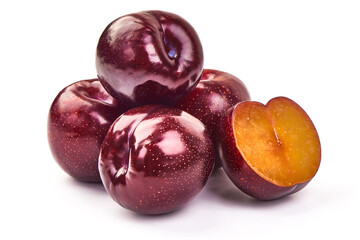 Red plums with green leaves, isolated on white background