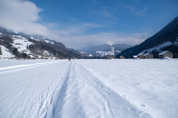 Obraz premium Winter mountain landscape with groomed cross-country trails. Swiss Alps, Switzerland, Europe