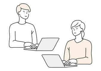 ノートPCを操作する男女