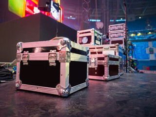 Preparation for concert concept. Cases for musical equipment on stage. Sound equipment transport...