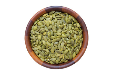 top view of peeled pumpkin kernels in wooden bowl isolated on white background