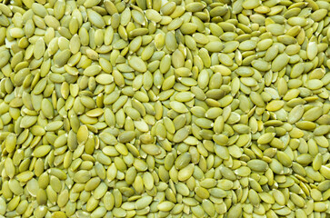 peeled pumpkin kernels background