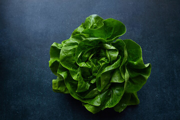 fresh lettuce on the kitchen table - 422654816