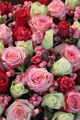 Pink and purple roses in a big wedding centerpiece