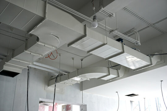 Installation of cold air ducts and air conditioning systems in buildings and painted in white color.