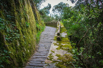 Beautiful outdoor park of Fraga da Pena, in the region of Aldeias de Xisto, Portugal. Stone trails and stone houses in the middle of the forest