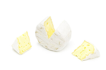 Organic piece of delicious brie cheese. Whole head and two halves are isolated on a white background. Cheese with white mold.