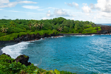 Fototapeta na wymiar Black Sand Beach and Tropical Coastline along the Road to Hana, Maui, Hawaii