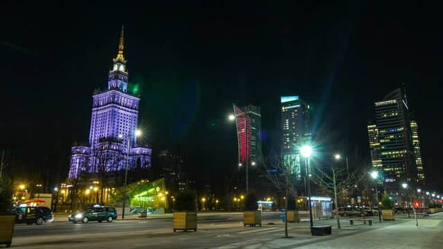 Warsaw night motion timelapse in city centre. View to the science palace at nigth, traffic lights, city life 
