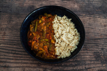 vegan stir fry with peanut sauce and coconut milk rice, healthy plant-based food