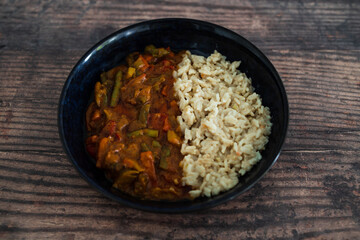 vegan stir fry with peanut sauce and coconut milk rice, healthy plant-based food