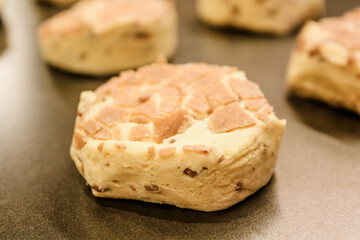 Delicious uncooked cinnamon roll on a pan waiting to be cooked