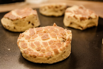 Delicious uncooked cinnamon roll on a pan waiting to be cooked