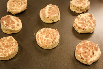 Delicious uncooked cinnamon roll on a pan waiting to be cooked