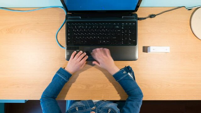 girl studying remotely in front of laptop