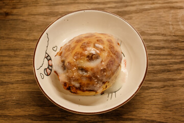 Delicious hot cinnamon roll with icing