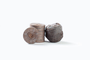 Isolated compacted peat pellets (pod) for seed starting are used by gardeners. Peat is harvested...