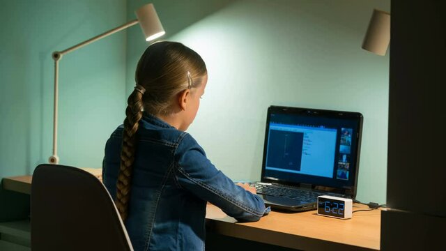 girl studying remotely in front of laptop