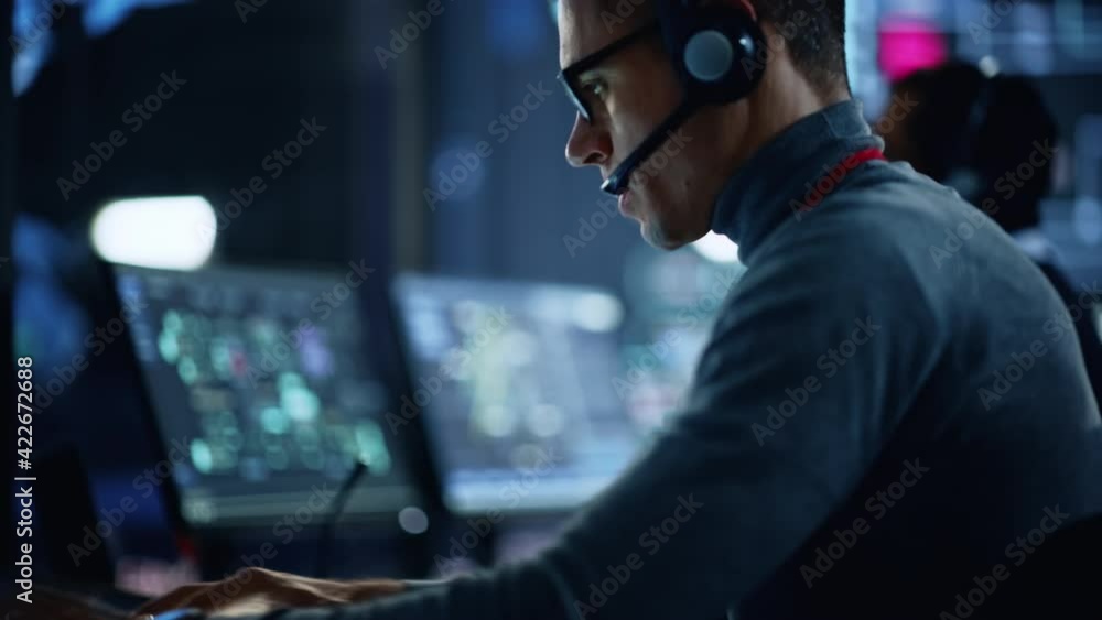 Poster Close Up of Professional IT Technical Support Specialist Working on Advanced Computer with Modern Touch Tablet Displays in Monitoring Control Room with Digital Screens. Manager Using Virtual Keyboard.