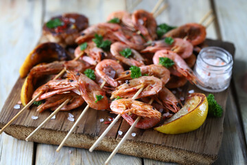 Shrimp kebabs. Grilled shrimp on sticks. Delicious shrimp with spices and lemon.