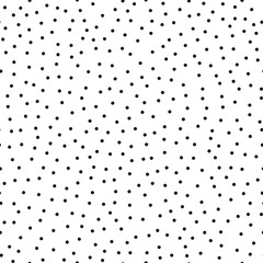 Seamless pattern. Points in a chaotic order, black on a white background.