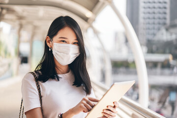 Closeup young adult business asian working woman wear face mask for protect virus corona or covid19.