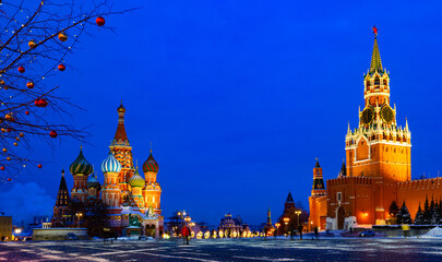 Fototapeta na wymiar Scenic night view of Red Square in Moscow in winter overlooking Saint Basils Cathedral and Spasskaya Tower, Russia