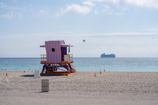 Miami Beach scene with lifeguard tower cruise ship and parasail