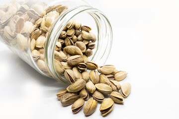 A Jar of pistachios in nut shell, isolated, white background