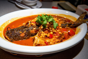 Delicious Chinese Guangxi cuisine, braised sour bamboo shoots Laoyou fish