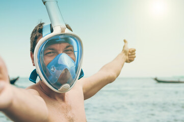 Happy Young Man in Full Face Mask Going to the Sea for Snorkeling in Beautiful Weather