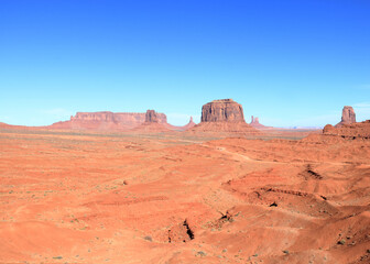 Fototapeta na wymiar Mitten and Merrick Butte in the distance, Monument Valley, Arizona