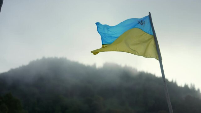 National flag of ukraine developing on flagstaff. Patriotism concept.
