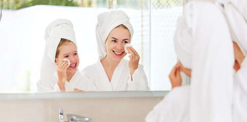 Mother and daughter doing face skin care