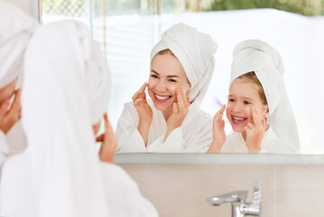 Loving mother and daughter during spa skin care