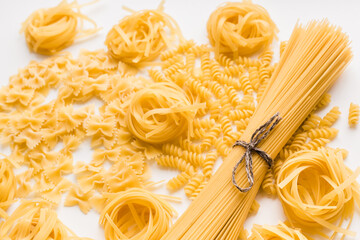pasta on a white plate, raw pasta, spaghetti on a white plate 