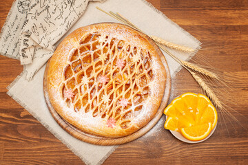 sweet fruit pie on a wooden table. top view homemade cakes.