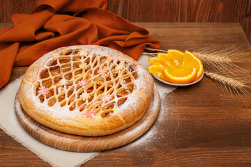 orange pie on a wooden table. Homemade baking. Sweet fruit pie