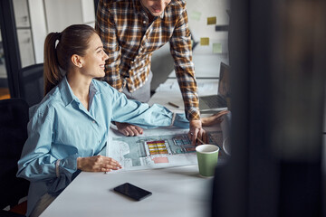 Two designers working at a new technical drawing