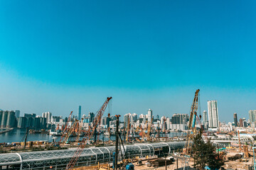 Naklejka premium Top view at large construction sites and many cranes are working in the, Industry new building business.