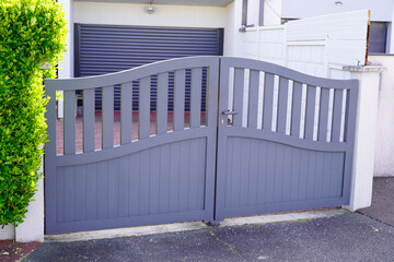 Obraz na płótnie Canvas Aluminum modern style home gray gate portal of suburb door house