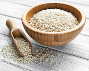 Sesame seeds in a bowl  on a rustic table