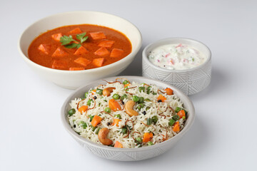 Veg biryani or pulav  served with Cottage cheese or Paneer Butter Masala- indian recipe 