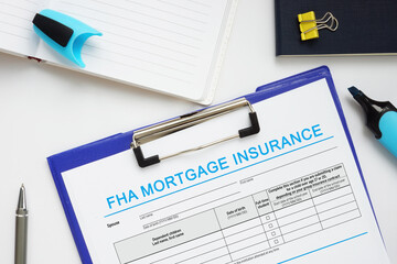 Financial concept meaning FHA MORTGAGE INSURANCE with inscription on the business paper