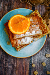 Traditional Belgian waffles, blood oranges and  sugar for sweet breakfast