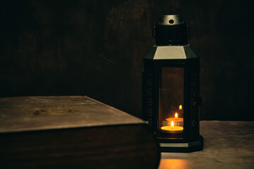 Fototapeta na wymiar lantern with candle and book
