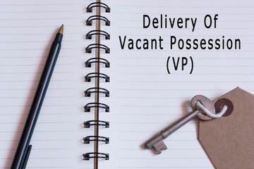 Text on notepad with pen and house key - Delivery of vacant possession