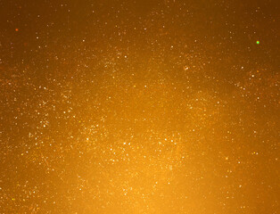 Golden starry glitter background. Gold glitter lights