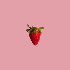 fresh red strawberry with green leaves on pink light background. summer creative idea for backgroun