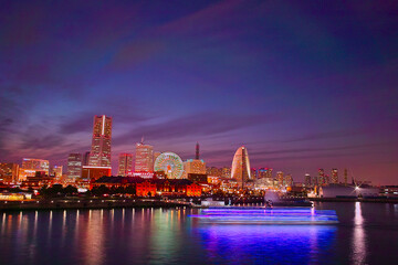 The skyline view of Yokohama harbour at night. Yokohama Port serves 38000 ships a year.